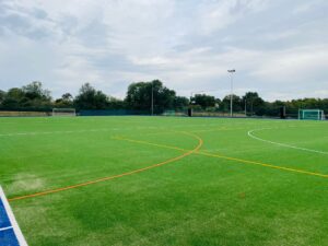 Large field with markings for sports activities 