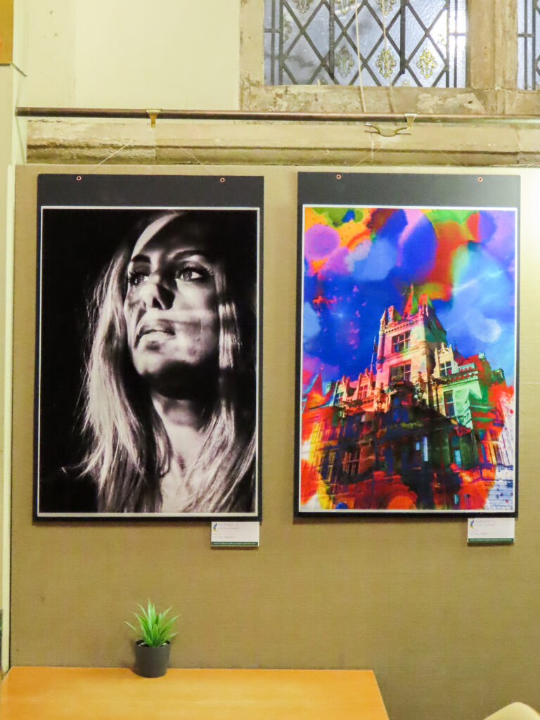 Two artworks hang on a wall