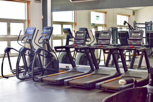 Running and cross training machines inside the gym.