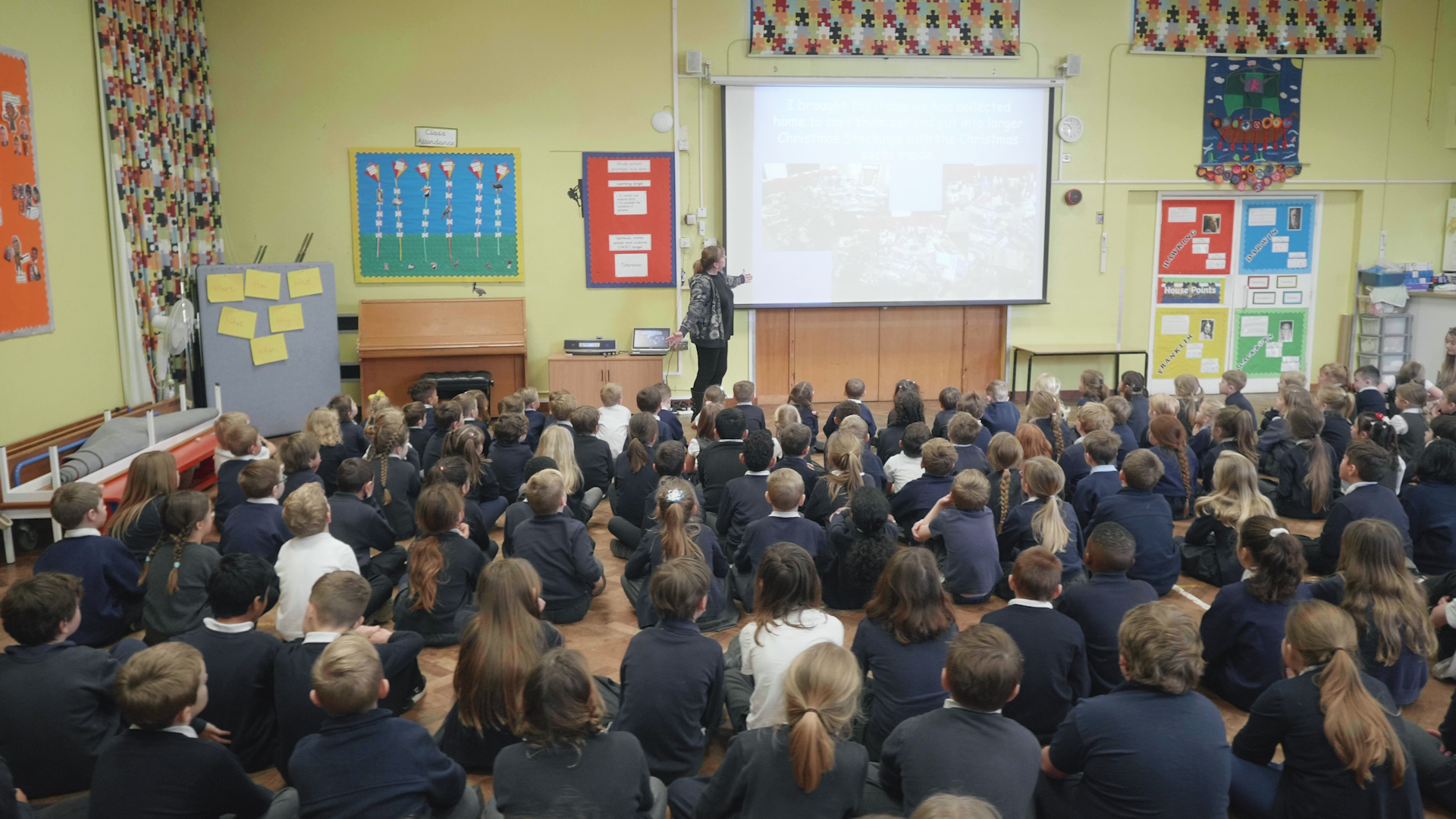 A teacher presenting to a group of children