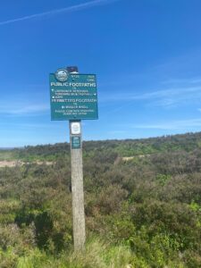 A sign showing a public footpath.