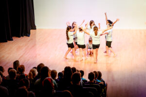 A group of children dancing in a circle