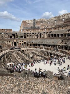 A view into an Amphitheatre with lots of tourists.