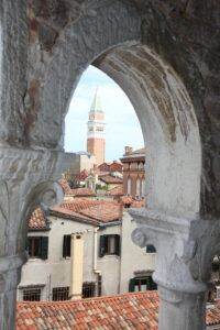 A view through a stone arch of a building.