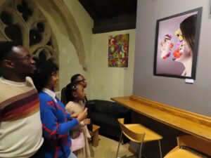 Family looking at artwork.