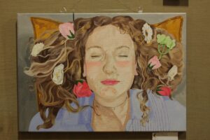 Artwork showing a person with their eyes closed.